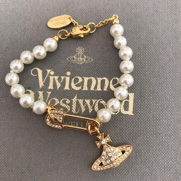 Vivienne Westwood Jewelry - Vivienne Westwood Orb Bracelet White 1 Row Fake Pearl Gold Clip with drawstring